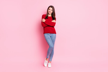 Full length photo of charming girl embrace shoulders beaming white smile wear red pullover denim jeans sneakers isolated pink color background