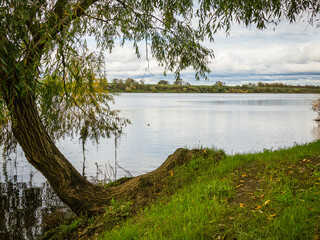 Riverside landscape view with autumn foliage