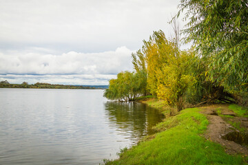 Riverside landscape view with autumn foliage
