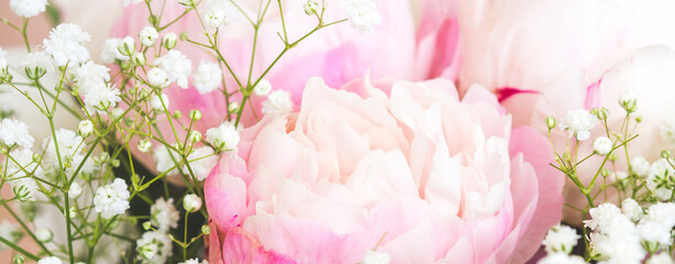 Pastel pink and white peonies bouquet background. Mothers day.