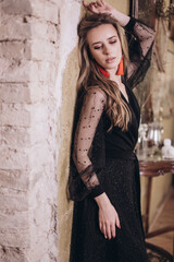 Young beauty woman portrait in black dress. Wedding, ellegance, fashion concept