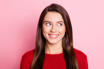 Fototapeta premium Photo portrait of dreamy smiling female student with brunette hair thinking about idea isolated on pink color background