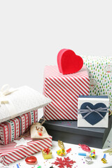 Various gift boxes on the table with Christmas ornaments. Winter's holiday celebration and gifting concept. 