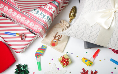 Various gift boxes on the table with Christmas ornaments. Winter's holiday celebration and gifting concept. 

