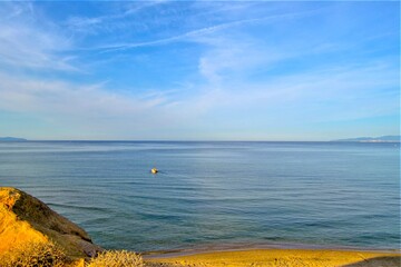 Sea of Marmara from Mudanya. Blue sea and sky together with the beach and fishermen.