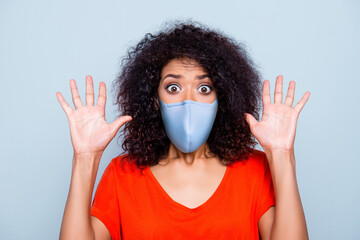 Close-up portrait of terrified worried wavy-haired girl wearing safety reusable mask stop mers cov...