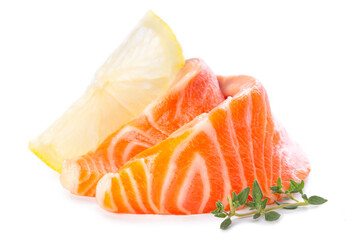 Fresh salmon sashimi slices and lemon