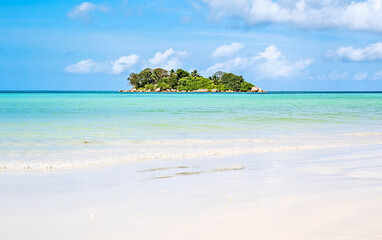 Single tropical island with blue sky and turquoise water, Seychelles