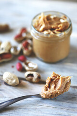 Peanut butter in a jar. Peanuts in shells.