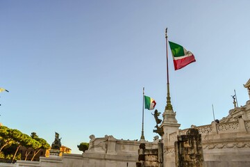 ITALY, ROME CITY, 23.12.2011. Piazza Venezia and Italian flags on it during sunny day. 