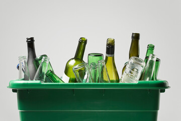 Empty bottles in green container