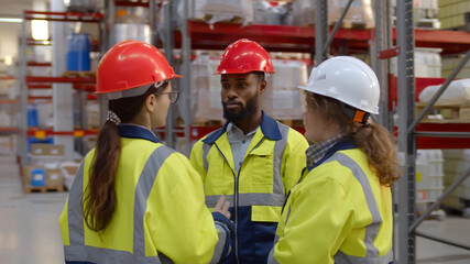 Team of industrial warehouse workers making revision of goods
