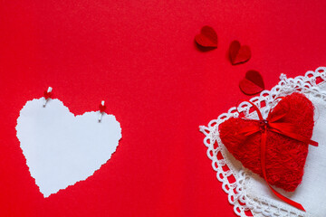 Valentine's day. Red heart with white blank note on red background