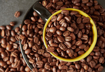 Coffee beans and hot coffee on the table