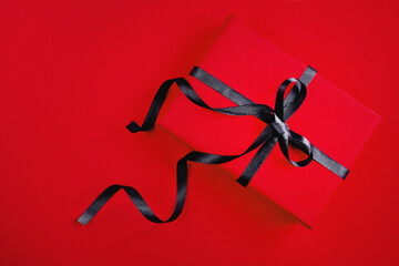 .top view of gift box on red background