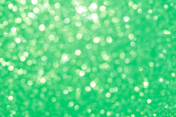 blurred festive emerald green glitter bokeh background