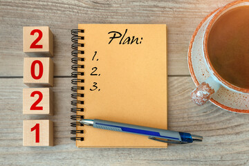 2021 Plan - inscription on a notebook and wooden cubes