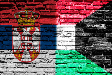 Flag of Serbia and Kuwait on brick wall