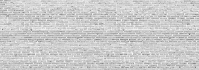 White brick wall. Vintage light background for creative design. The old wall.