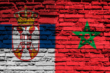 Flag of Serbia and Morocco on brick wall