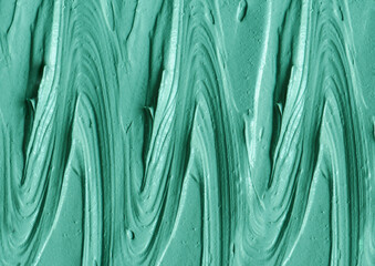 Green cosmetic clay (kelp facial mask, face cream, spirulina body wrap) texture close up, selective...