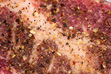 Fototapeta na wymiar Fresh raw seasoned pork steak meat macro close up shot top view