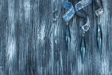 Christmas composition. Christmas balls, blue and silver decorations on blue wooden background. Flat lay. Top view. Copy space
