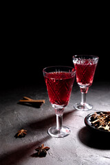 Creative holiday beverage cocktail in geometry drinking glass oh black background