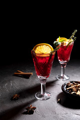 Creative holiday beverage cocktail in geometry drinking glass oh black background