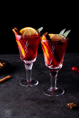 Creative holiday beverage cocktail in geometry drinking glass oh black background