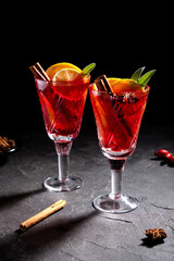 Creative holiday beverage cocktail in geometry drinking glass oh black background