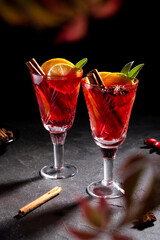 Creative holiday beverage cocktail in geometry drinking glass oh black background