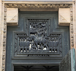 Cast bronze decoration of the pediment in Prague Castle with the inscription 