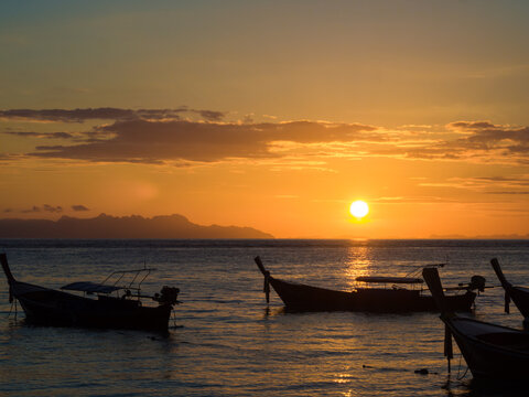 Boat on sea beach colorful sky sunset nature vacation landscape © themorningglory