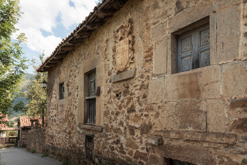 Old building in Mogrovejo town in Cantabria, Spain