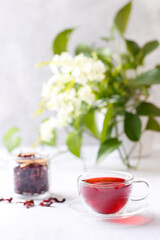 Healthy hibiscus tea in transparent cup