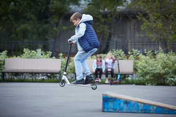 The guy in the jump on the kick scooter