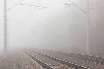 Railroad tracks stretching into the misty distance. The path into fog and uncertainty.