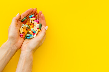 Fototapeta premium Medical capsule pills in hands top view