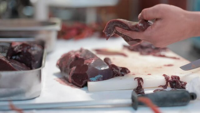 Raw liver cut to pieces with a knife. The famous dinner of the city of Edirne.