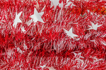 christmas festive background christmas tree red foil tinsel close up