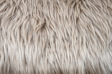abstract background of an elegant warm beige fur close up