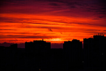 Fototapeta na wymiar Sunset in the city bright red