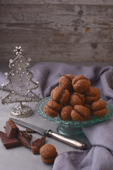 Italian homemade chocolate cookies with nuts for the Christmas and New Year holidays - Baci di dama