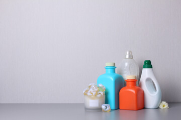 Laundry detergent on desk.Washing products on gray background.