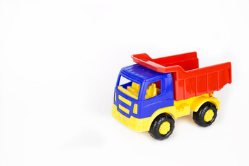 Isolated machine truck toy stands on a white background. Place for text