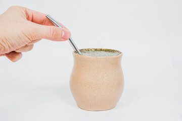 Yerba mate tea in a special vessel and with a drinking tube. The concept of strengthening the body,...