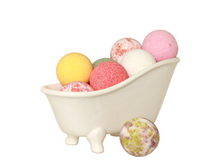 Bath bombs in a decorative tub isolated on a white background
