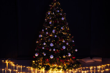 Christmas tree garland lights with New Year's Eve gifts