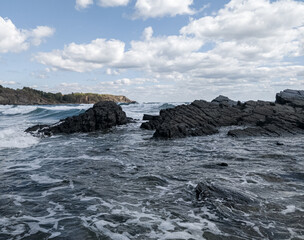 Coast of sea with clouds and sand of beach